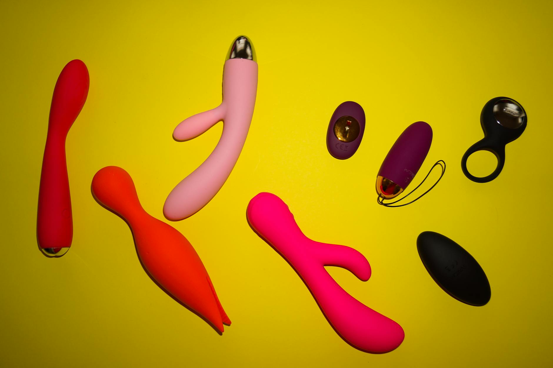 A couple standing together indoors, holding a blue vibrator, symbolizing modern intimacy and reconnection